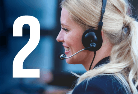 Blonde haired call centre woman wearing a black headset with blurred data screens in the background and with a number 2 figure overlay